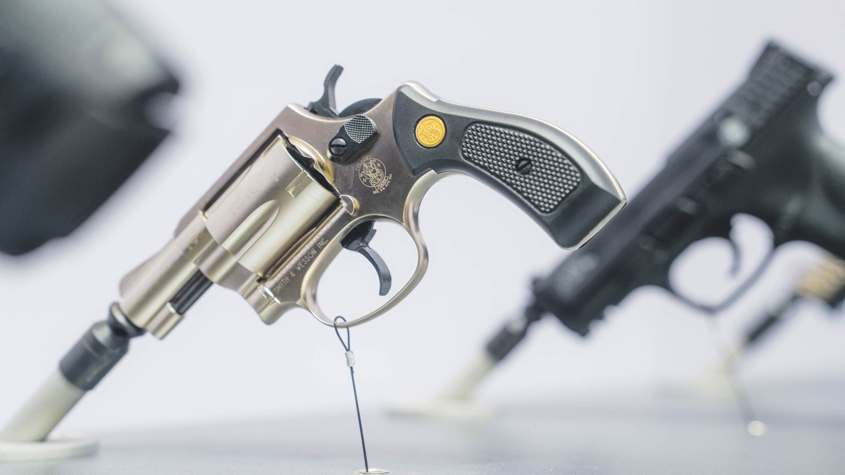 Close-up of two weapons