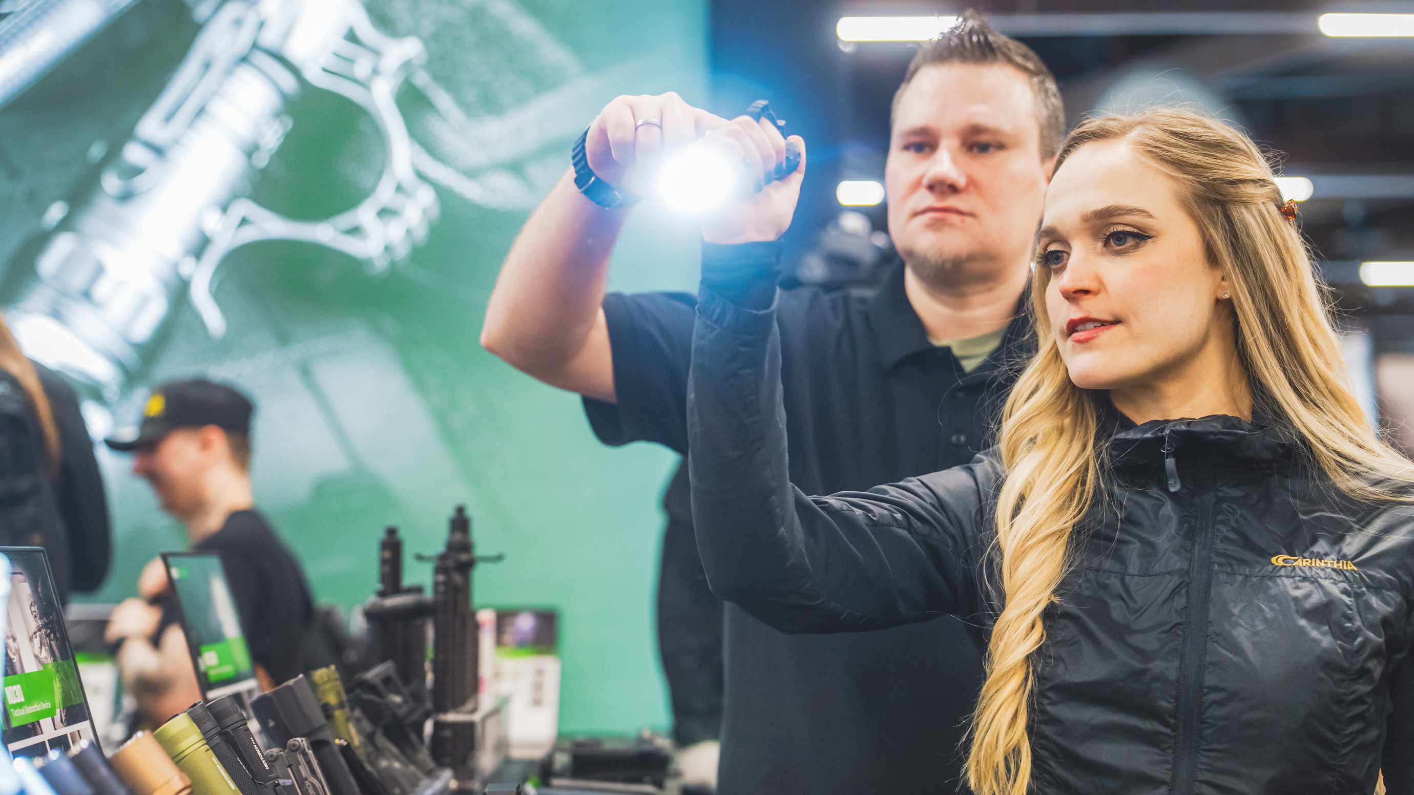 Two people are testing a flashlight