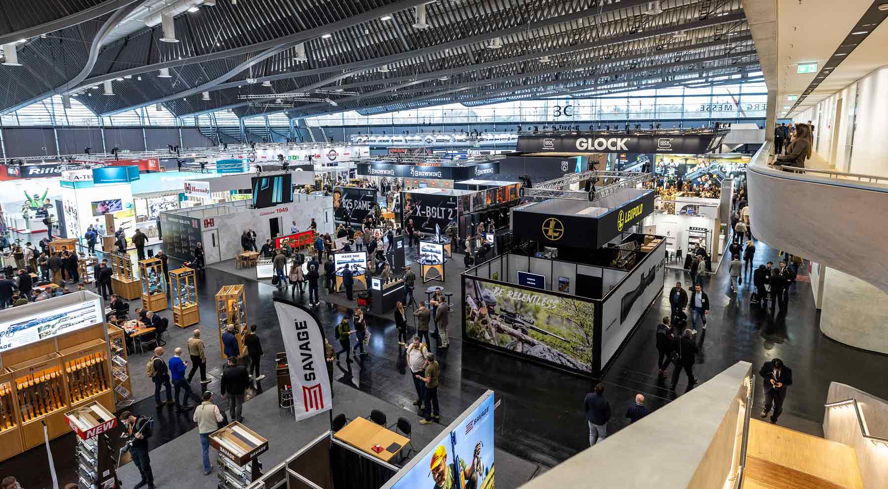 View from above of Hall 3C at IWA OutdoorClassics with numerous exhibition stands. Many visitors are moving through the spacious hall.